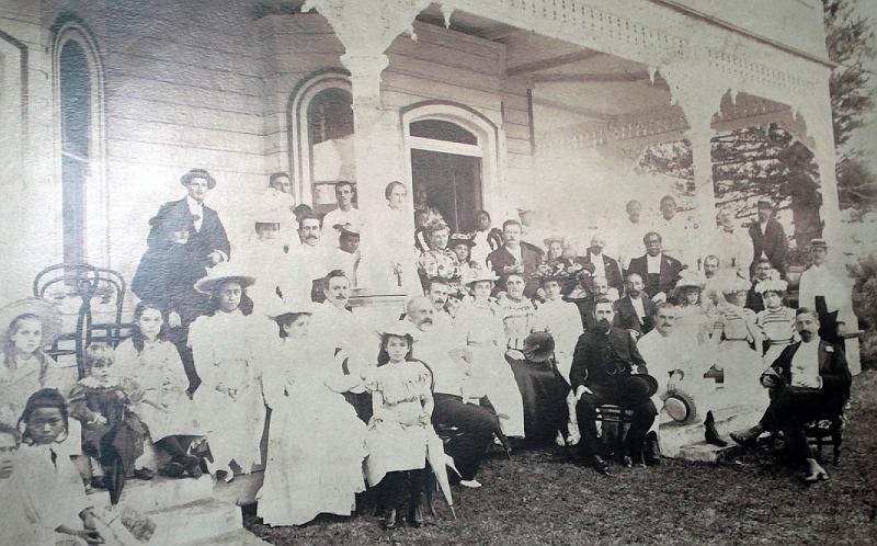 Tonga-05-Seib-2011.jpg - Palace party, Royal Palace, Nuku´alofa, 1899; photographer: unknown; This photograph appeared in New Zealand´s Auckland Weekly News in 1899. King Tupou II himself is in the photograph standing almost out of view at the doorway of the palace (source: Tonga National Culture Centre, Nuku´alofa)(Photo by Roland Seib).