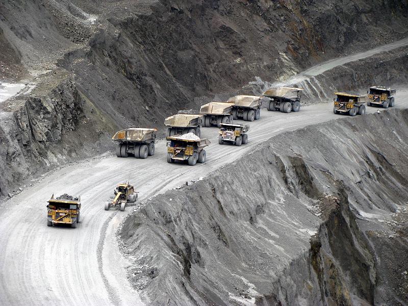 Papua2-04-Zoellner-2008.jpg - Caterpillar trucks bring their load to the surface. They can carry more than 100 tons each (Photo by Siegfried Zöllner)