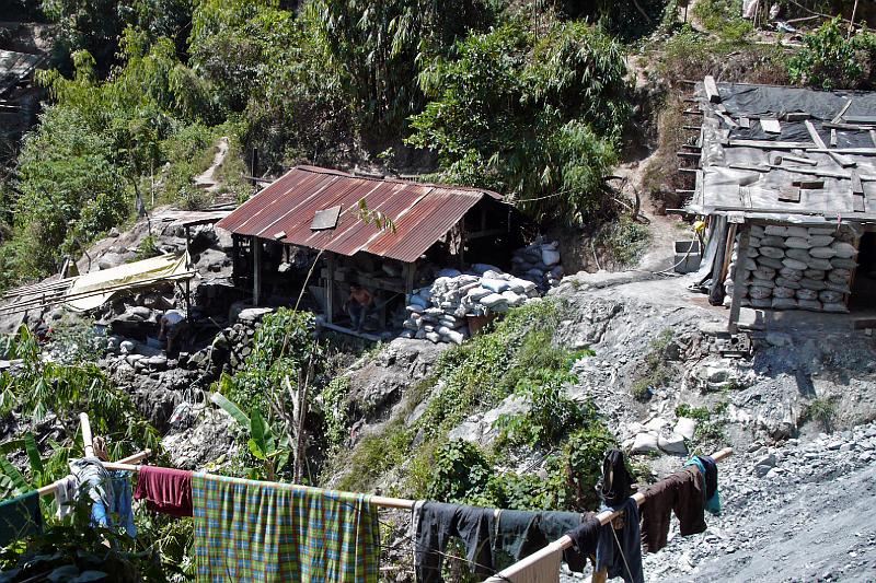 Philippines-35-Seib-2012.jpg - Panning for gold; the bags contain rocks for a second (chemical) processing outside the area (Photo by Roland Seib)