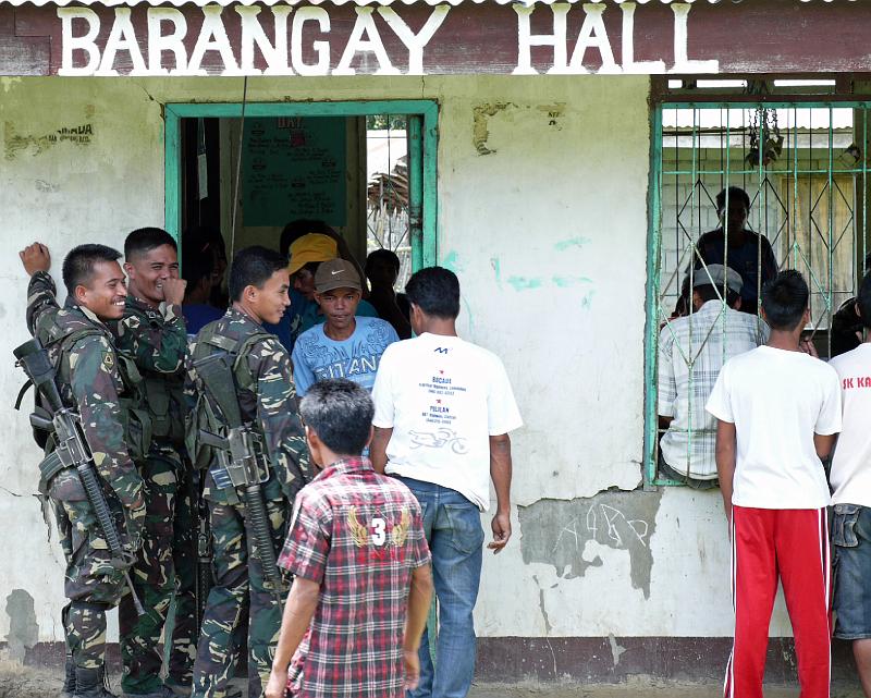 Philippines-68-Seib-2012.jpg - Consultation with village people in Sinapulan on large-scale mining; safety escort by the Army (Photo by Roland Seib)